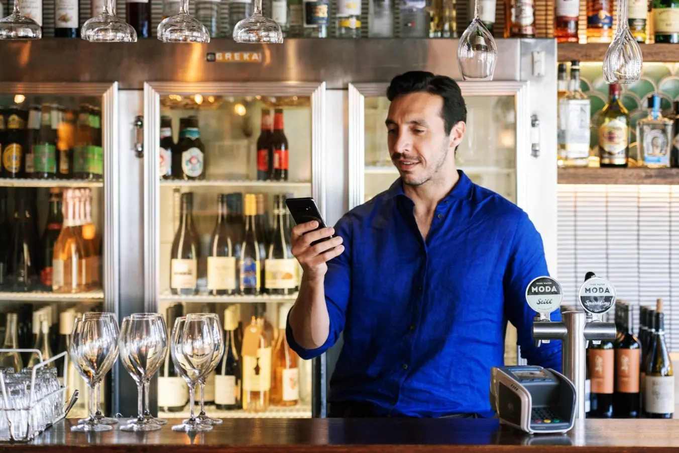 Cafe owner checking the tyro bank app