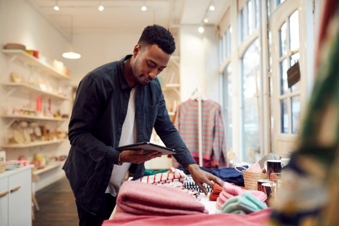 A guy is preparing his store for the festive season