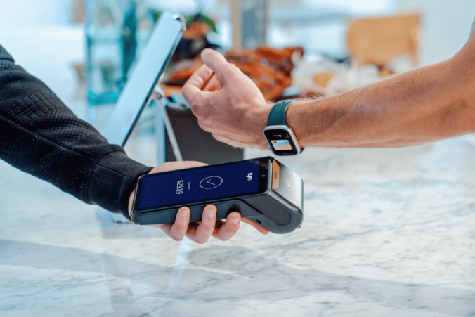 Watch tapping a EFTPOS machine