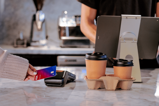 EFTPOS machine with coffee next to it