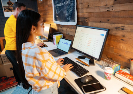 small business owner on working on multiple screens
