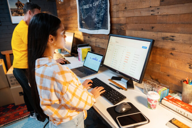 small business owner on working on multiple screens
