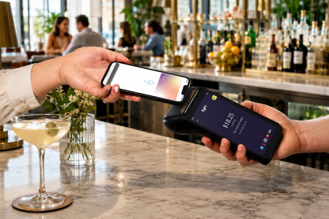 Card tapping a Tyro pro in a restaurant.