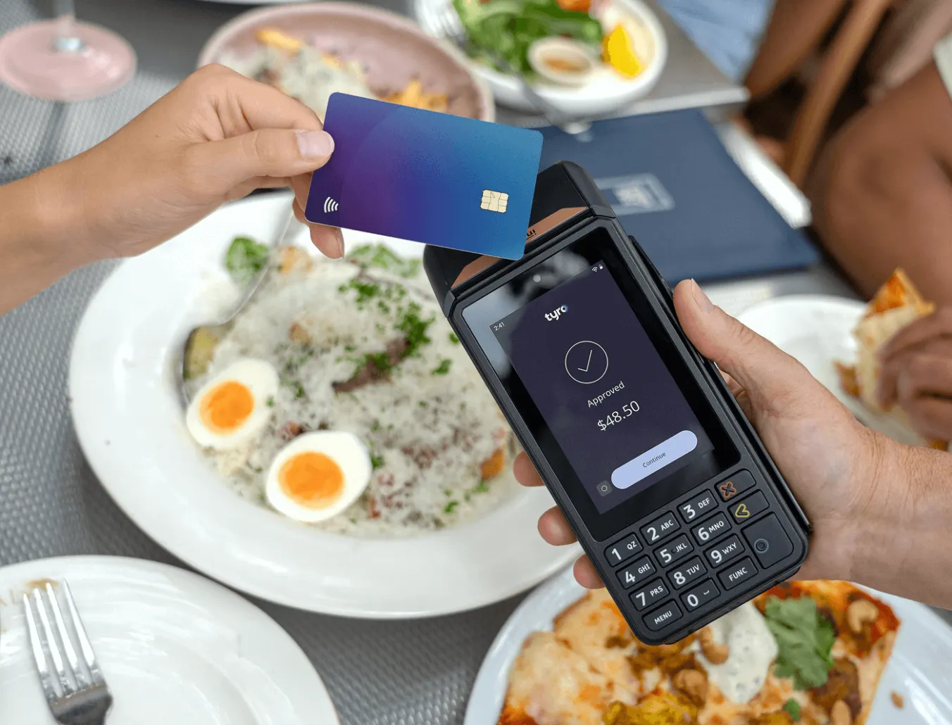 Customer paying at a restaurant with Tyro Pro Key