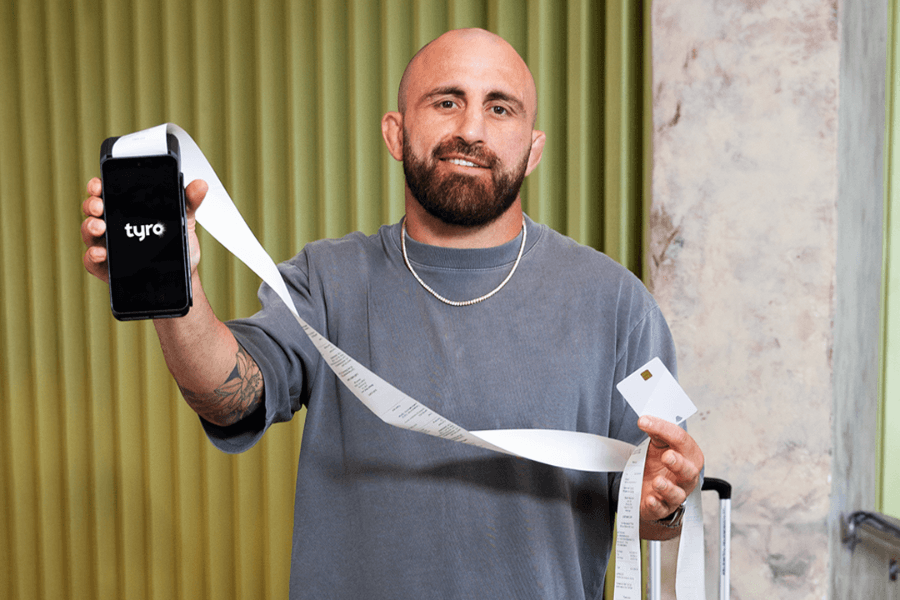 Volk holding EFTPOS and receipt