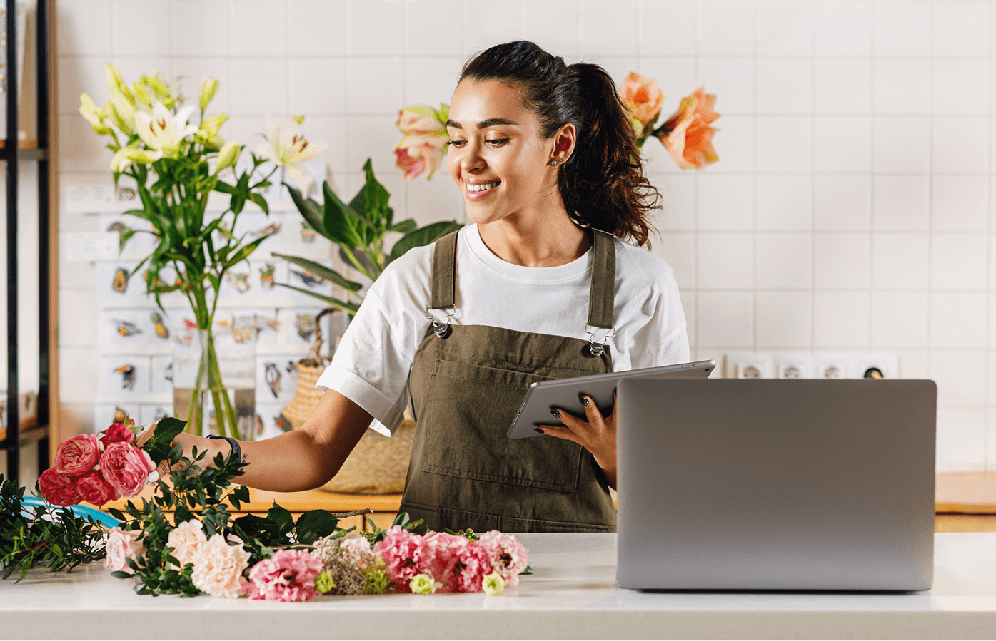 Florist owner banking on her laptop