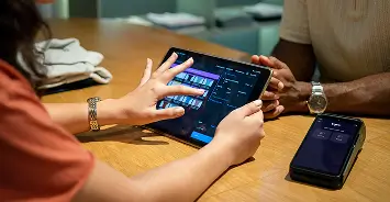 Person tapping a tablet