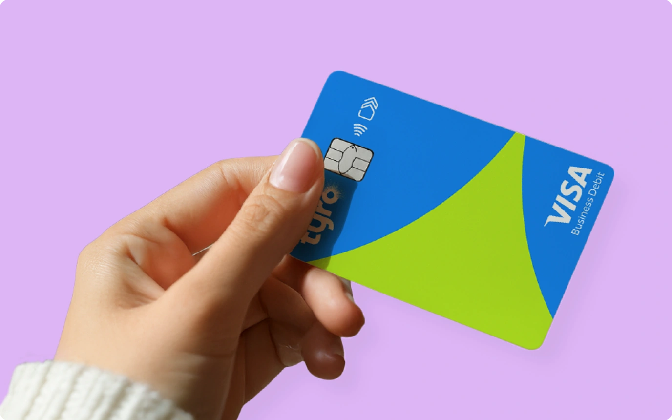 woman holding Tyro's business visas debit card