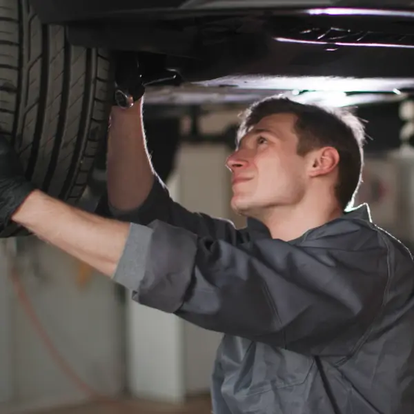 Person inspecting car
