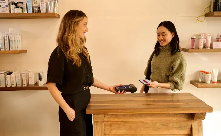 Person tapping Tyro Pro Touch in a retail store