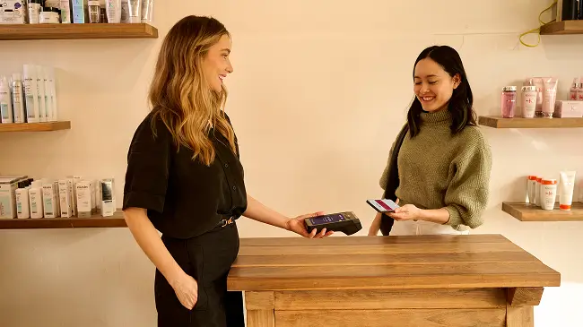 Person tapping Tyro Pro Touch in a retail store