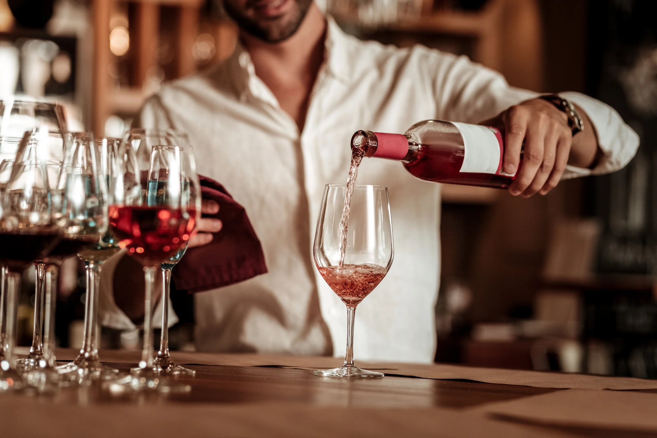 waitress serving wine in wine bar