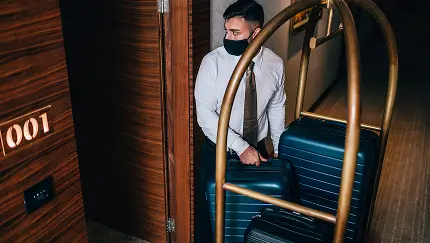 Person putting suitcases away